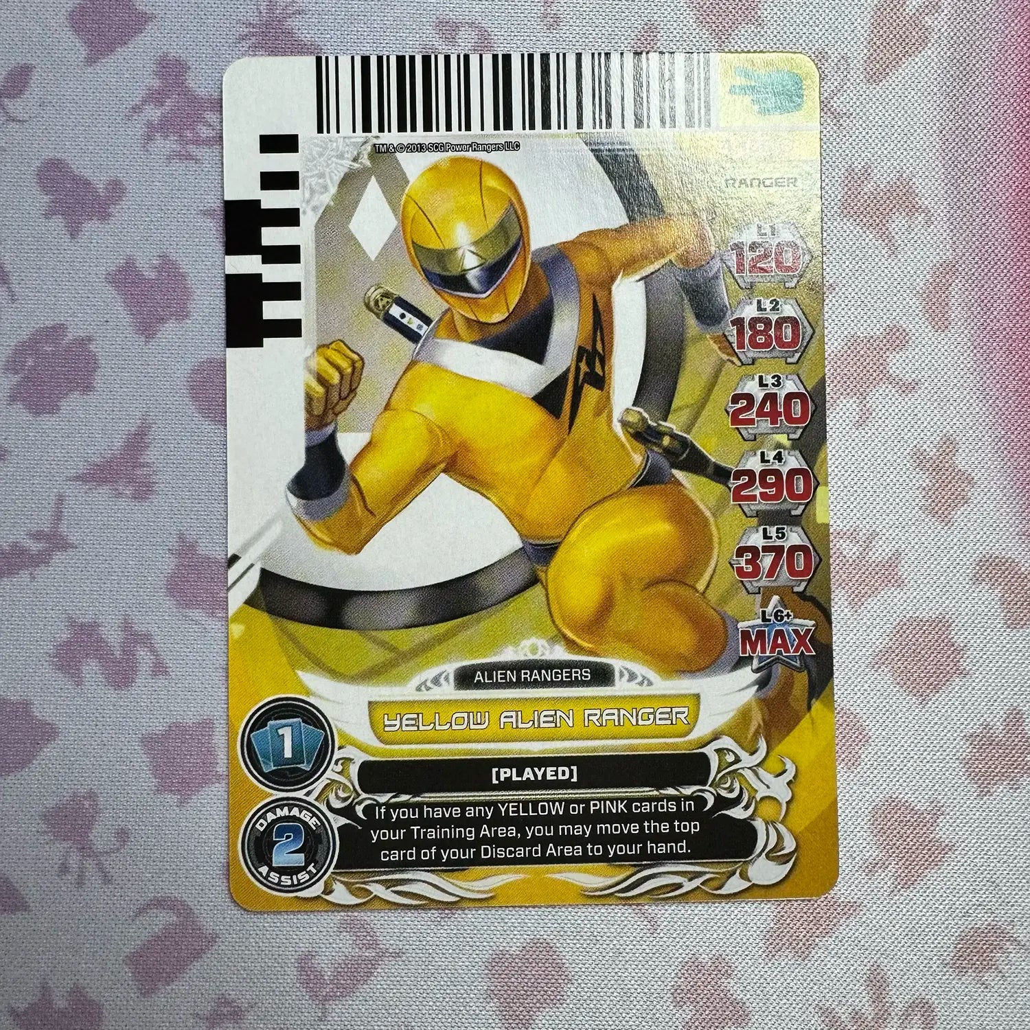 Common card featuring the Yellow Alien Ranger from Mighty Morphin Alien Rangers. Found in the Legends Unite expansion to the Power Rangers Action Card Game